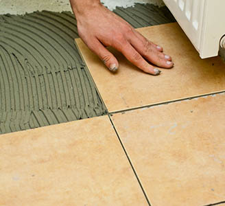 Tiling a floor - PW Property Repair Tiling Services